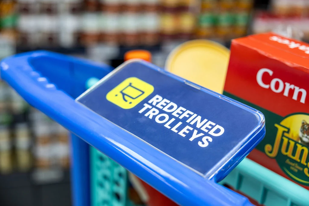 Redefined branded advertising panel photographed on a trolley handle Redefined branded advertising panel photographed on a trolley handle